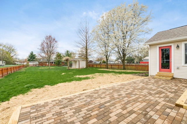 277 Cherrington Rd, Westerville, OH 43081 - view of patio / terrace featuring a storage shed, entry steps, an outbuilding, and a fenced backyard