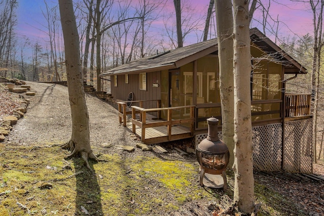 exterior space featuring a sunroom and a deck