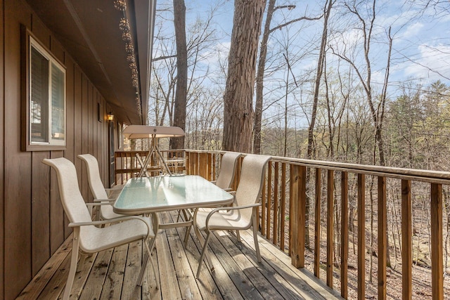 wooden deck with outdoor dining space