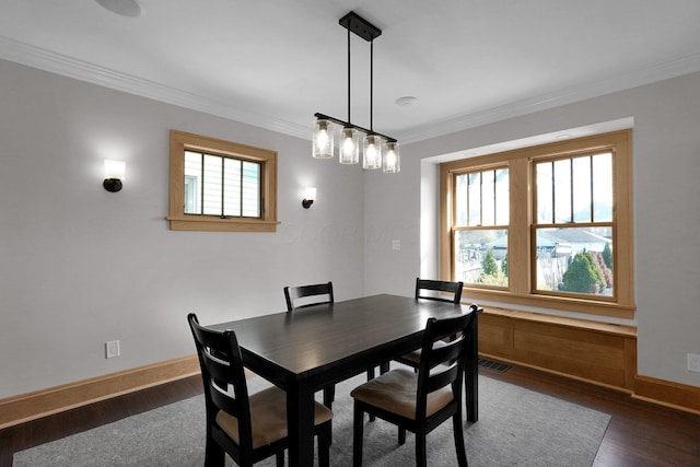 78 N Burgess Ave, Columbus, OH 43204 - dining space with dark wood-style flooring, baseboards, ornamental molding, and visible vents