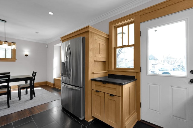 78 N Burgess Ave, Columbus, OH 43204 - kitchen featuring stainless steel fridge with ice dispenser, ornamental molding, dark tile patterned floors, dark countertops, and baseboards