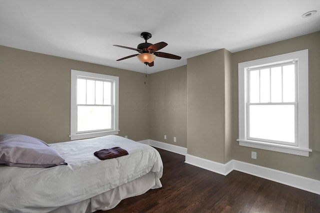 78 N Burgess Ave, Columbus, OH 43204 - bedroom with baseboards, a ceiling fan, and dark wood finished floors