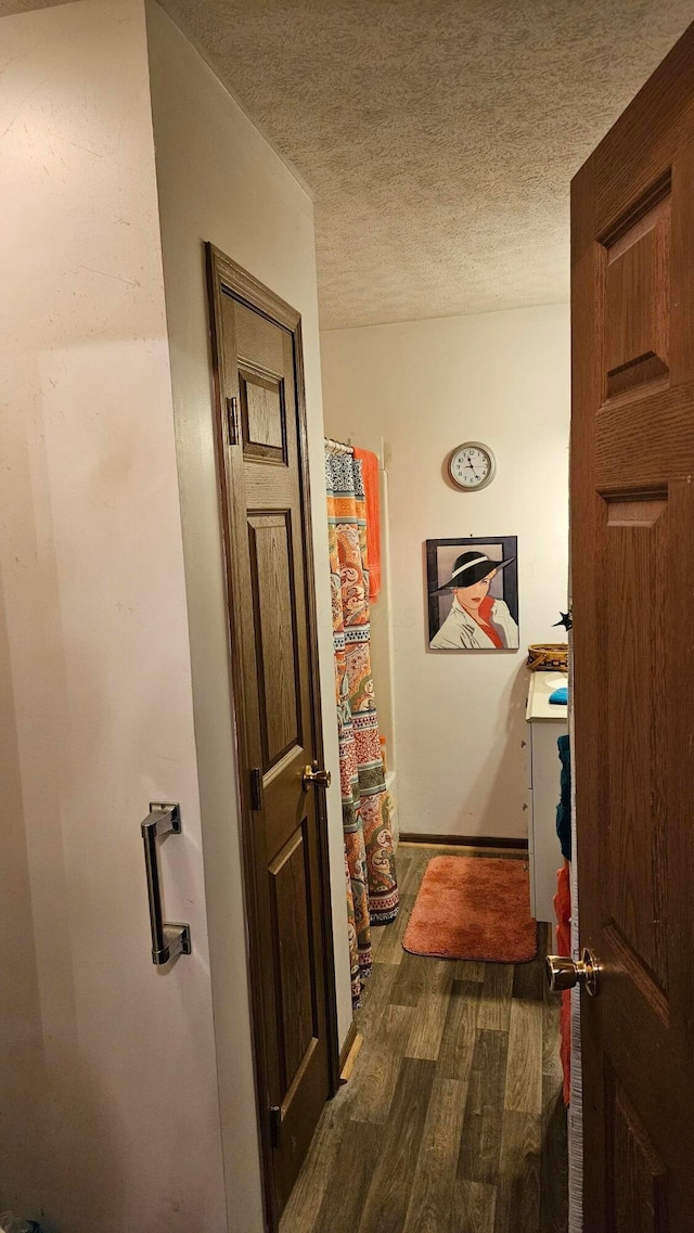 620 Lewis St, Washington Court House, OH 43160 - hallway with dark wood-type flooring, baseboards, and a textured ceiling