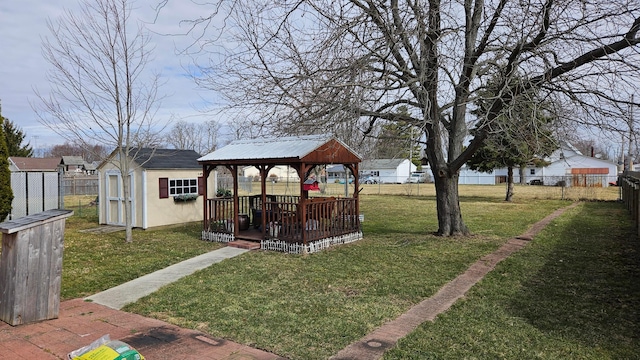 620 Lewis St, Washington Court House, OH 43160 - view of yard with a gazebo, a fenced backyard, a storage shed, and an outbuilding