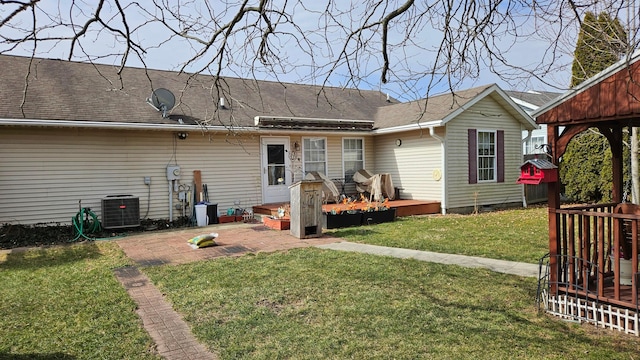 620 Lewis St, Washington Court House, OH 43160 - rear view of house featuring central AC unit, a deck, a yard, a patio, and roof with shingles