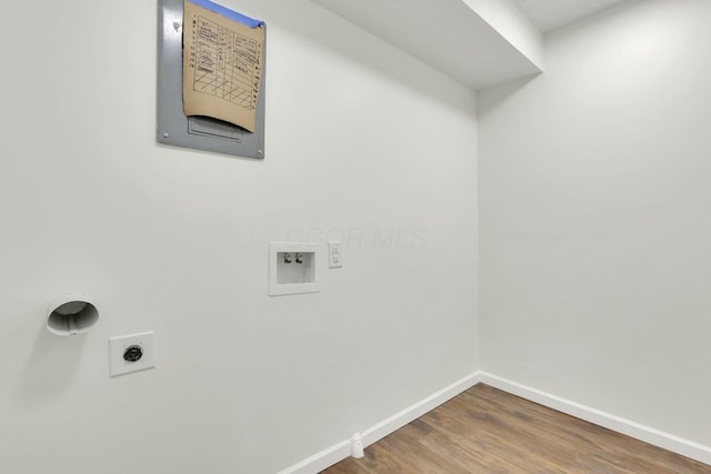 clothes washing area featuring laundry area, wood finished floors, washer hookup, hookup for an electric dryer, and baseboards