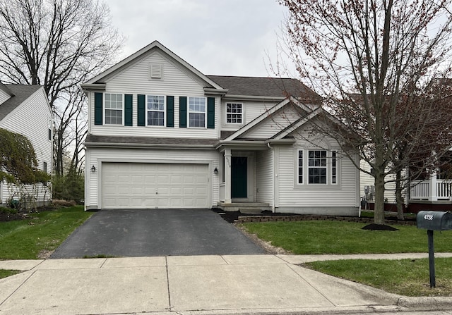 4238 Greensbury Dr, New Albany, OH 43054 - traditional-style home featuring a garage, asphalt driveway, a front lawn, and a shingled roof
