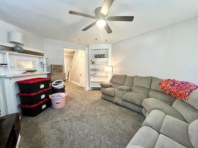 carpeted living area featuring a ceiling fan