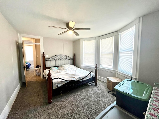 bedroom with carpet flooring, baseboards, and ceiling fan