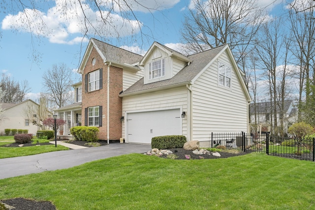 6690 Hermitage Dr, Westerville, OH 43082 - view of front facade with a garage, a front yard, fence, and aphalt driveway