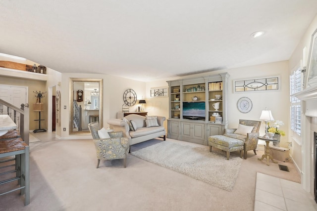 6690 Hermitage Dr, Westerville, OH 43082 - living area with a fireplace with flush hearth, baseboards, carpet, and stairs