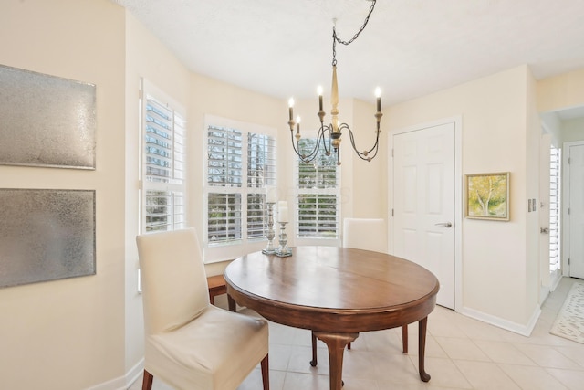 6690 Hermitage Dr, Westerville, OH 43082 - dining area with baseboards, a chandelier, and light tile patterned floors