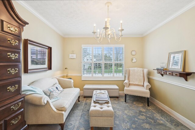 6690 Hermitage Dr, Westerville, OH 43082 - sitting room with ornamental molding, baseboards, a notable chandelier, and a textured ceiling