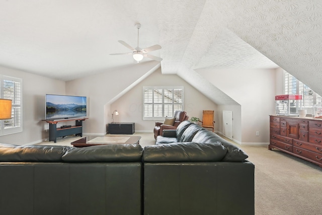 6690 Hermitage Dr, Westerville, OH 43082 - living area featuring light colored carpet, lofted ceiling, a ceiling fan, and baseboards