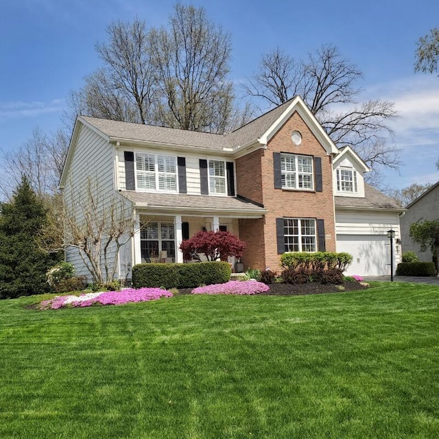 6690 Hermitage Dr, Westerville, OH 43082 - traditional-style home featuring brick siding, a front yard, and aphalt driveway