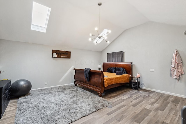 1779 Fairwood Ave, Columbus, OH 43207 - bedroom with vaulted ceiling with skylight, baseboards, and light wood-type flooring