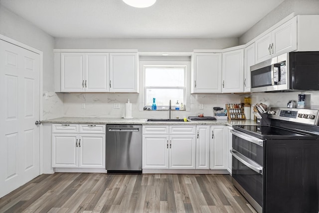 1779 Fairwood Ave, Columbus, OH 43207 - kitchen featuring appliances with stainless steel finishes and white cabinets
