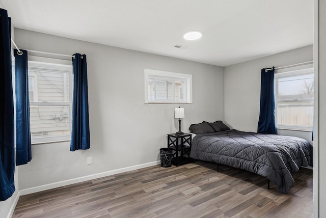 1779 Fairwood Ave, Columbus, OH 43207 - bedroom with visible vents, baseboards, and wood finished floors