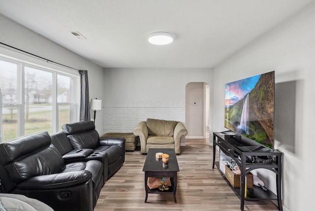 1779 Fairwood Ave, Columbus, OH 43207 - living area featuring arched walkways, wood finished floors, and visible vents