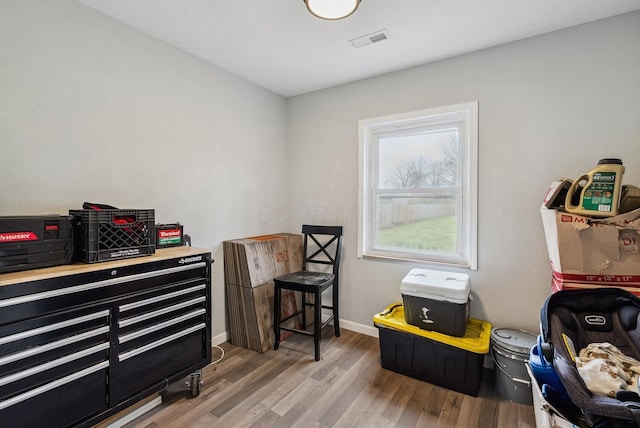 1779 Fairwood Ave, Columbus, OH 43207 - misc room featuring visible vents, baseboards, and wood finished floors