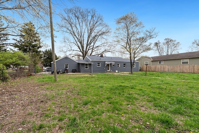 1779 Fairwood Ave, Columbus, OH 43207 - rear view of property with a yard, fence private yard, and a chimney