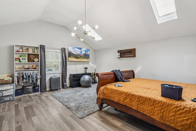 1779 Fairwood Ave, Columbus, OH 43207 - bedroom featuring a chandelier, wood finished floors, and lofted ceiling with skylight