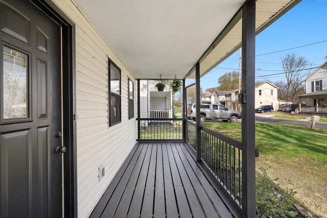 121 Granville St, Pataskala, OH 43062 - wooden terrace featuring a residential view, covered porch, and a lawn