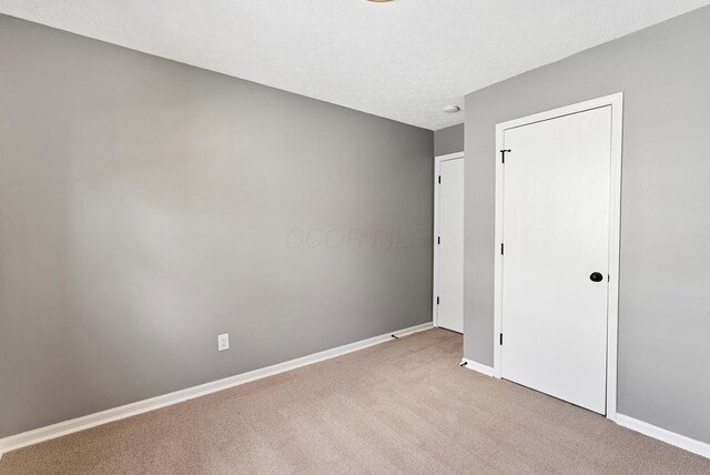 121 Granville St, Pataskala, OH 43062 - unfurnished bedroom with baseboards and carpet floors