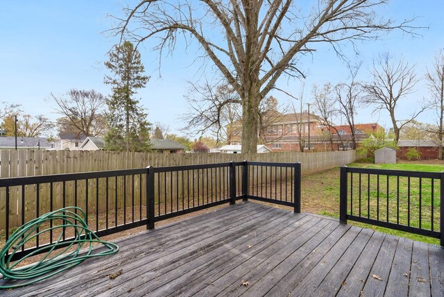 121 Granville St, Pataskala, OH 43062 - wooden deck with an outbuilding, a fenced backyard, a shed, and a yard