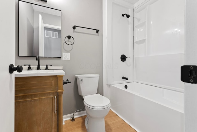121 Granville St, Pataskala, OH 43062 - bathroom with vanity, baseboards, toilet, visible vents, and wood finished floors