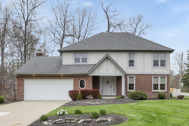 view of front facade with stucco siding, a front yard, brick siding, a chimney, and driveway