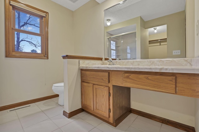 full bath featuring a shower stall, baseboards, visible vents, and toilet