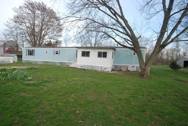 20543 Treaty Line Rd, West Mansfield, OH 43358 - back of property with a lawn and crawl space