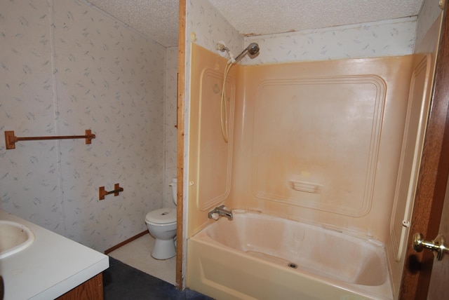 20543 Treaty Line Rd, West Mansfield, OH 43358 - bathroom with vanity, wallpapered walls, a textured ceiling, toilet, and bathtub / shower combination