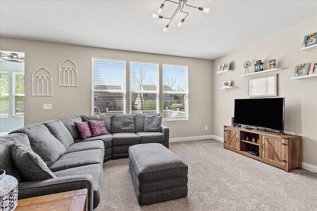 carpeted living area with baseboards and plenty of natural light