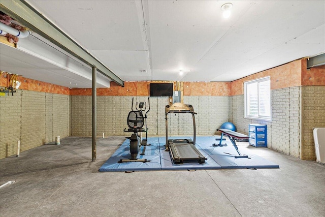 workout area with brick wall