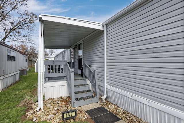2445 Columbus Lancaster Rd NW Unit 147, Lancaster, OH 43130 - property entrance featuring a lawn and central AC