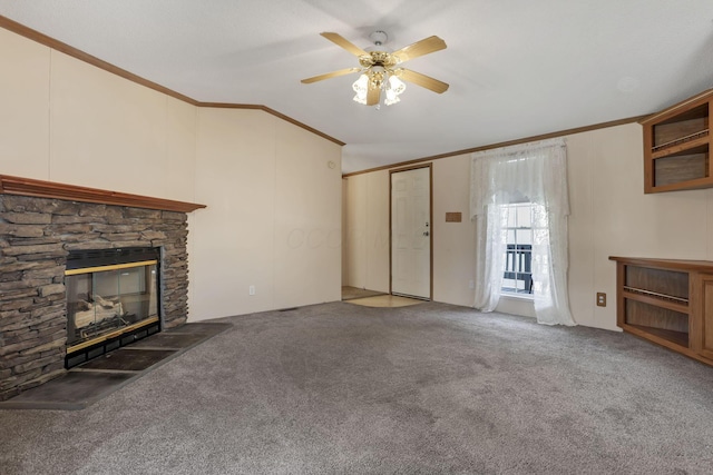 2445 Columbus Lancaster Rd NW Unit 147, Lancaster, OH 43130 - unfurnished living room with ornamental molding, a stone fireplace, a ceiling fan, and carpet floors