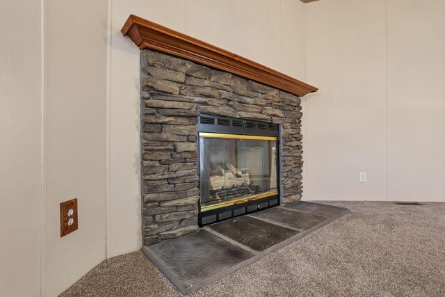 2445 Columbus Lancaster Rd NW Unit 147, Lancaster, OH 43130 - room details with a stone fireplace and carpet flooring