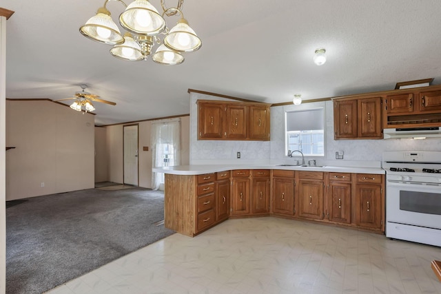 2445 Columbus Lancaster Rd NW Unit 147, Lancaster, OH 43130 - kitchen featuring white range with gas cooktop, light countertops, brown cabinets, ceiling fan with notable chandelier, and a sink