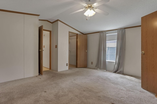2445 Columbus Lancaster Rd NW Unit 147, Lancaster, OH 43130 - unfurnished bedroom with a ceiling fan, carpet flooring, ornamental molding, and lofted ceiling