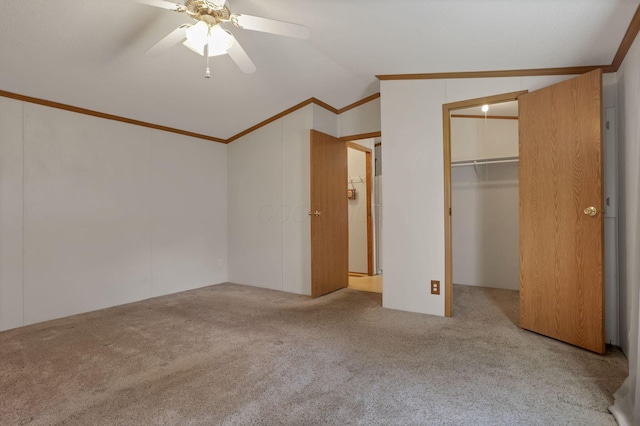 2445 Columbus Lancaster Rd NW Unit 147, Lancaster, OH 43130 - unfurnished bedroom featuring vaulted ceiling, carpet flooring, crown molding, a walk in closet, and ceiling fan