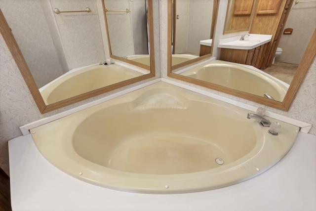 2445 Columbus Lancaster Rd NW Unit 147, Lancaster, OH 43130 - full bathroom featuring toilet, a bath, wallpapered walls, and vanity