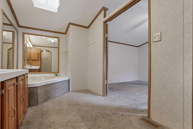 2445 Columbus Lancaster Rd NW Unit 147, Lancaster, OH 43130 - bathroom with ornamental molding, vanity, visible vents, and a garden tub