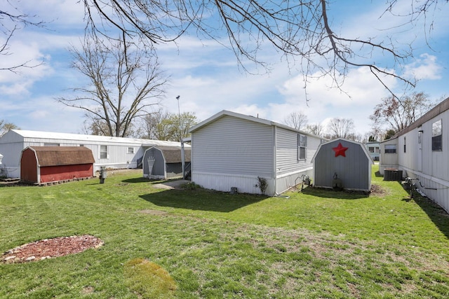 2445 Columbus Lancaster Rd NW Unit 147, Lancaster, OH 43130 - back of property featuring a shed, a yard, and an outbuilding