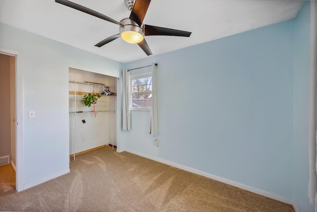 unfurnished bedroom with a closet, ceiling fan, baseboards, carpet flooring, and visible vents