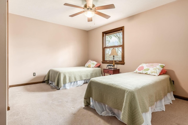 bedroom featuring ceiling fan, carpet flooring, and baseboards