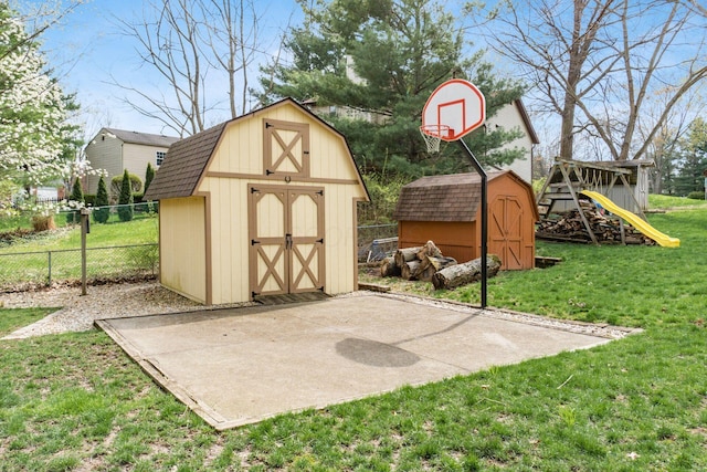 view of shed featuring fence