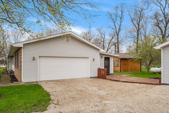 garage featuring driveway