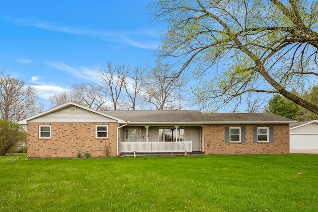 ranch-style house with brick siding, a porch, a garage, and a front lawn